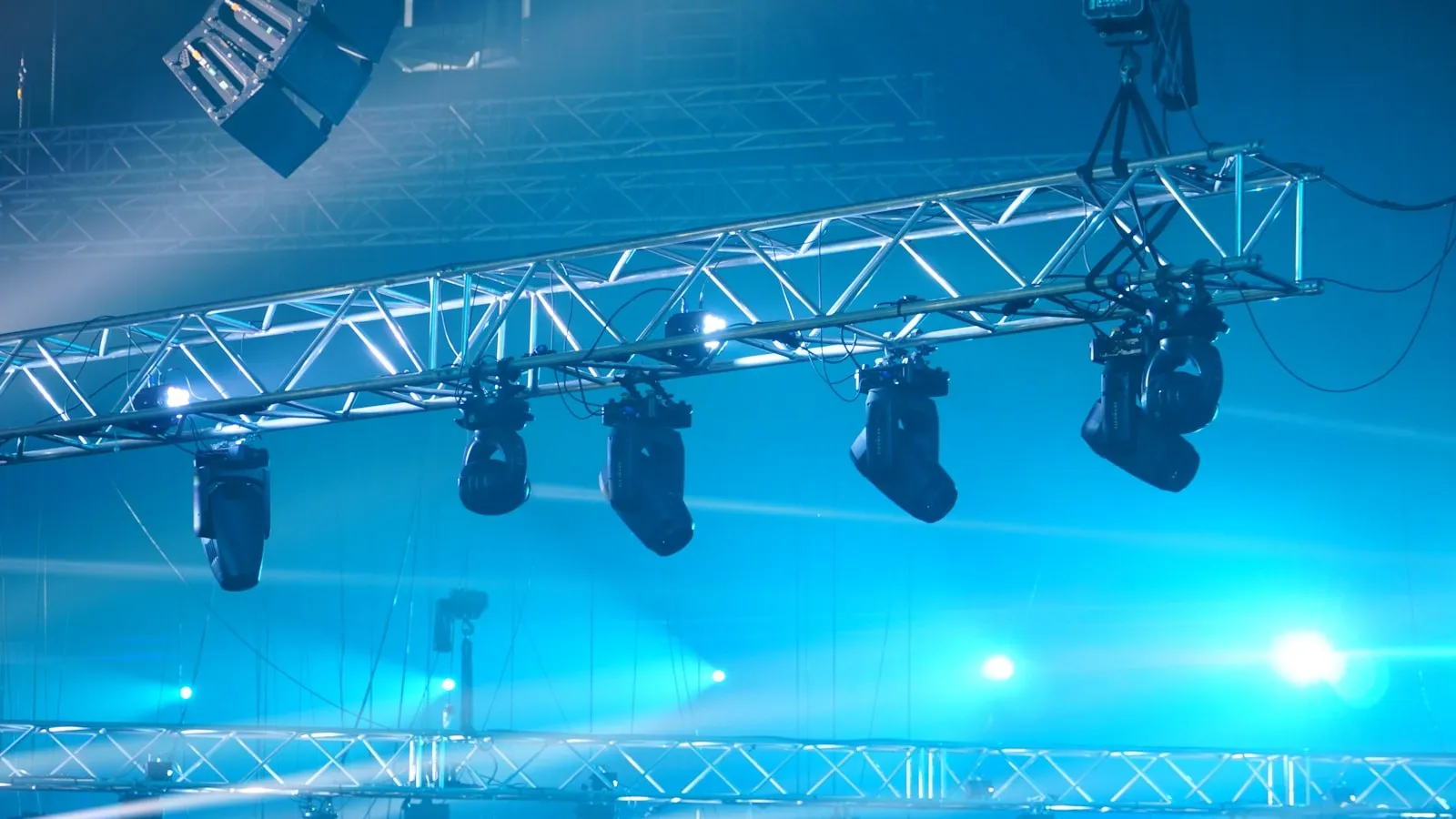 a stage set up for a concert with blue lighting